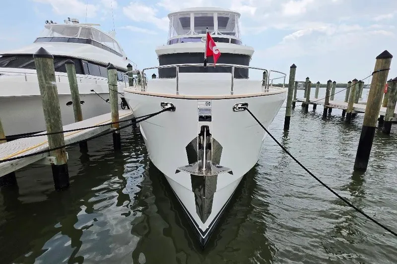 Slide: The Image of 2024 Sirena 58 Flybridge MY yacht docked at marina, front view. - 4