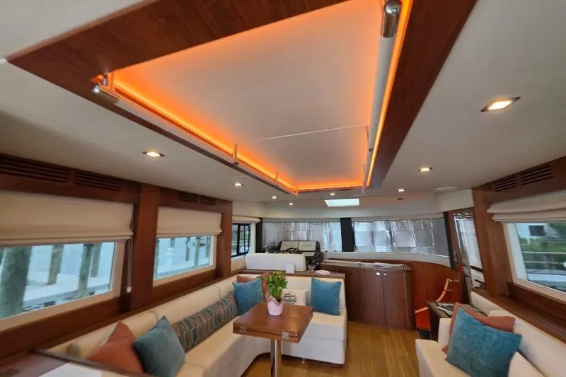 Slide: The Image of Luxurious interior of 2024 Sirena 58 Flybridge MY yacht with modern lighting and elegant seating. - 70