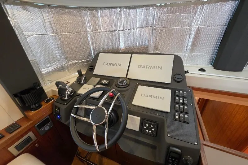 Slide: The Image of Helm of 2024 Sirena 58 Flybridge MY with Garmin navigation displays. - 82