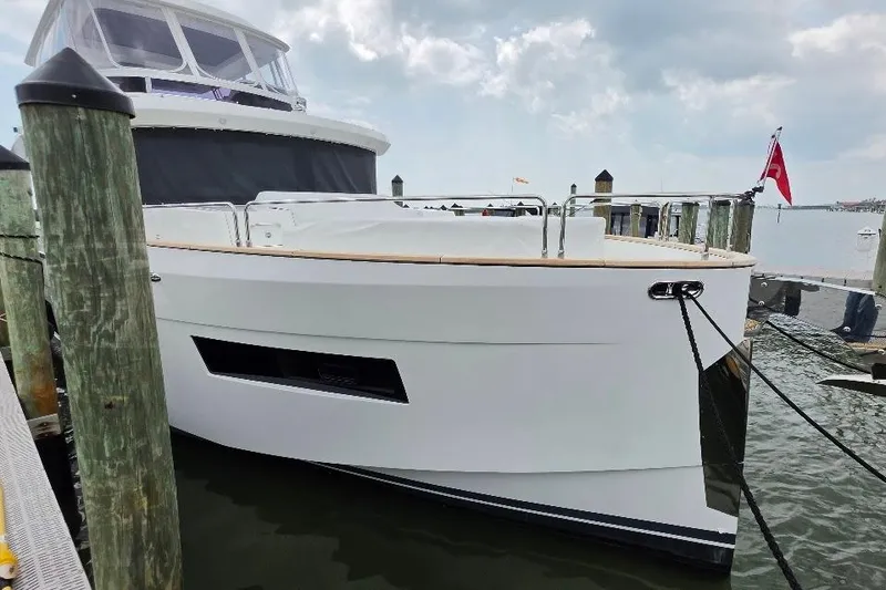 Slide: The Image of 2024 Sirena 58 Flybridge MY yacht docked at marina, featuring sleek design and modern amenities. - 5