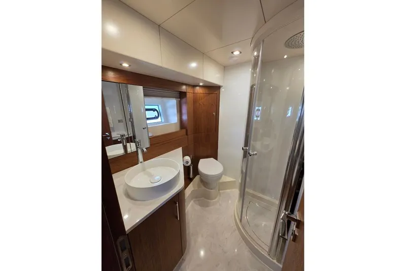 Slide: The Image of Luxurious bathroom in 2024 Sirena 58 Flybridge MY yacht with modern fixtures and elegant design. - 106