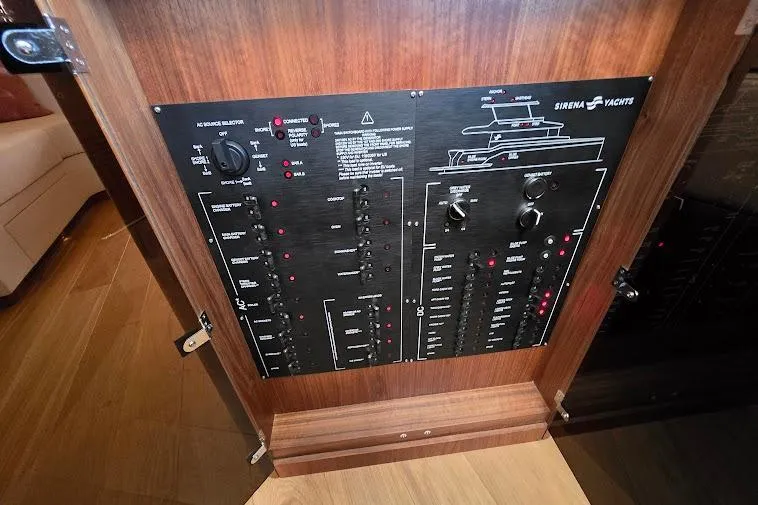 Slide: The Image of Control panel of 2024 Sirena 58 Flybridge MY yacht, featuring switches and indicators. - 93
