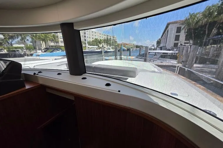 Slide: The Image of Interior view from 2024 Sirena 58 Flybridge MY yacht, showcasing marina and waterfront. - 91
