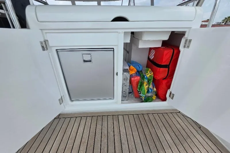 Slide: The Image of Storage compartment on 2024 Sirena 58 Flybridge MY yacht with safety gear and supplies. - 55