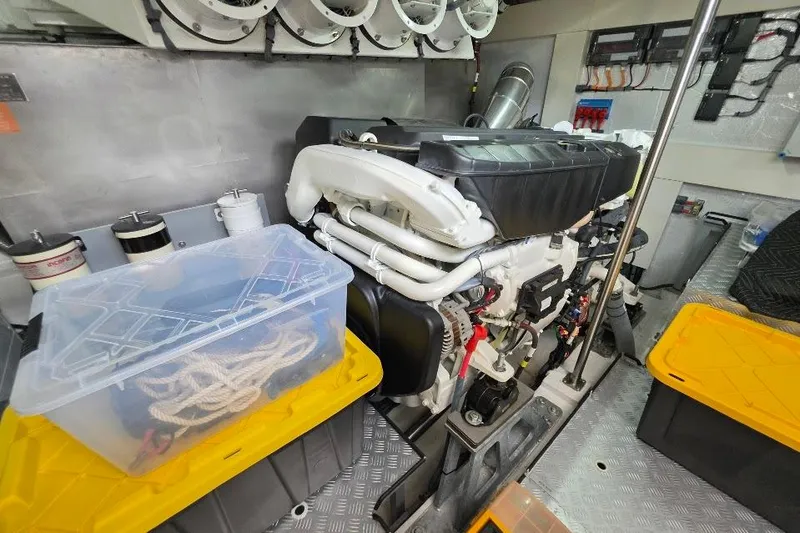 Slide: The Image of Engine room of 2024 Sirena 58 Flybridge MY yacht, featuring organized storage and modern equipment. - 125