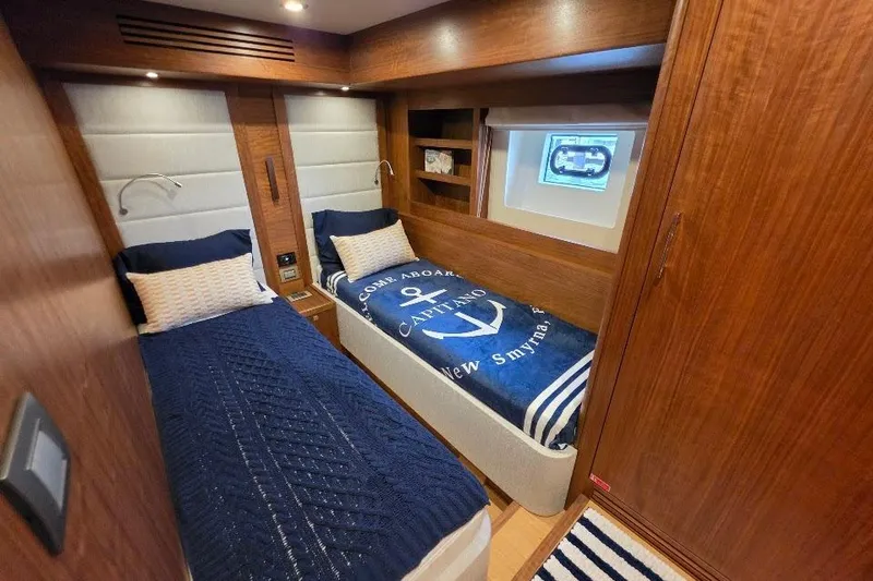 Slide: The Image of Luxurious cabin interior of 2024 Sirena 58 Flybridge MY yacht with twin beds. - 110