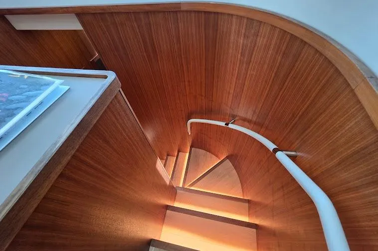 Slide: The Image of Elegant wooden staircase on 2024 Sirena 58 Flybridge MY yacht, showcasing modern design. - 94