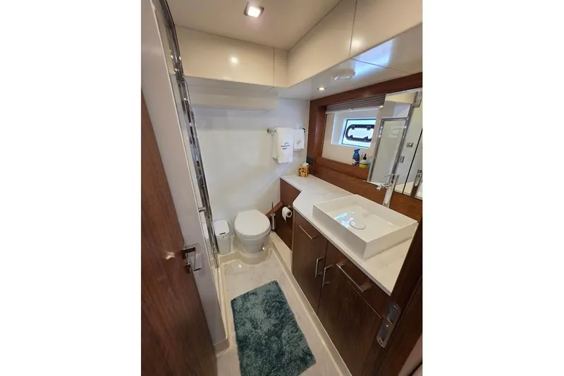 Slide: The Image of Luxurious bathroom in 2024 Sirena 58 Flybridge MY yacht, featuring modern fixtures and elegant design. - 105