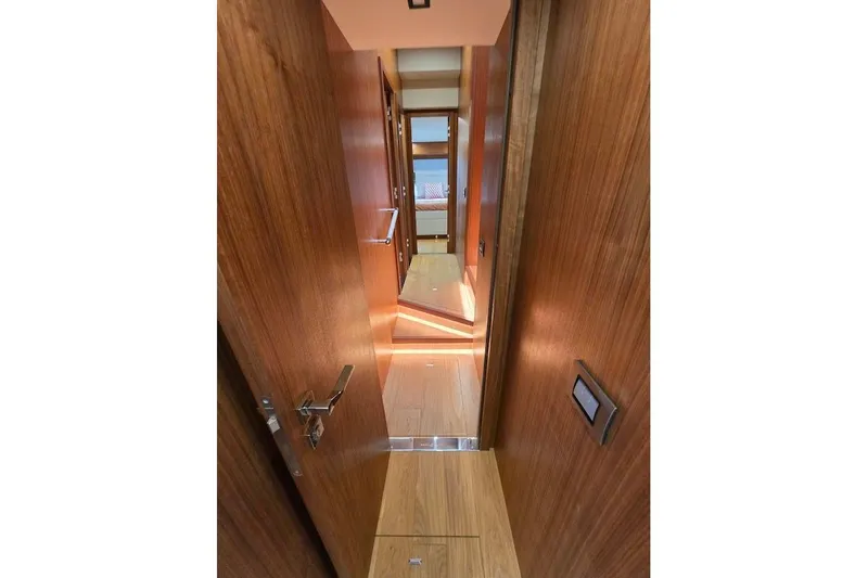 Slide: The Image of Luxurious wooden interior hallway of 2024 Sirena 58 Flybridge MY yacht. - 100