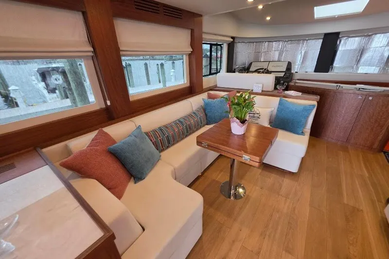 Slide: The Image of Luxurious interior of 2024 Sirena 58 Flybridge MY yacht with elegant seating and decor. - 77