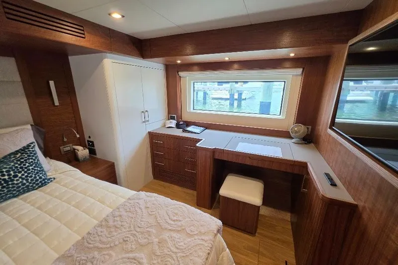 Slide: The Image of Luxurious cabin interior of 2024 Sirena 58 Flybridge MY yacht with elegant wood finishes. - 114