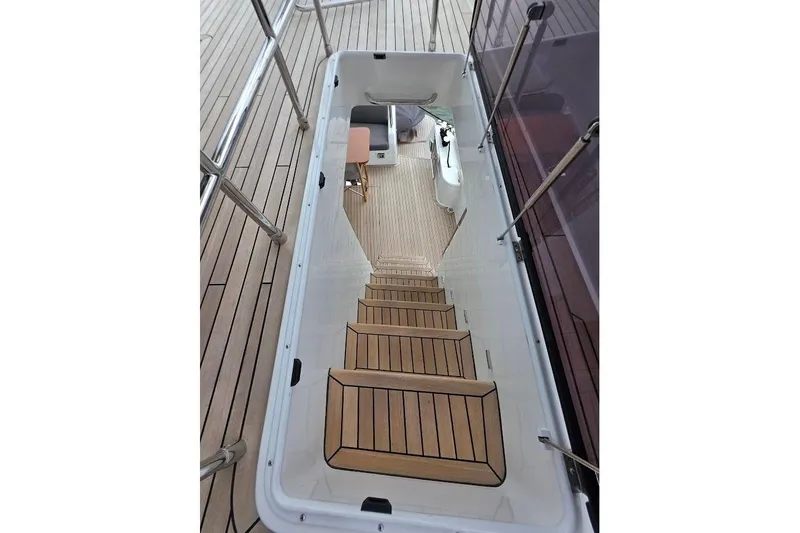Slide: The Image of Staircase on 2024 Sirena 58 Flybridge MY yacht with teak decking and modern design. - 58