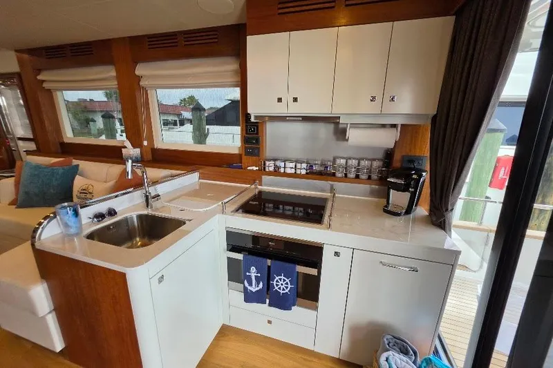 Slide: The Image of Modern kitchen interior of 2024 Sirena 58 Flybridge MY yacht with sleek design. - 60