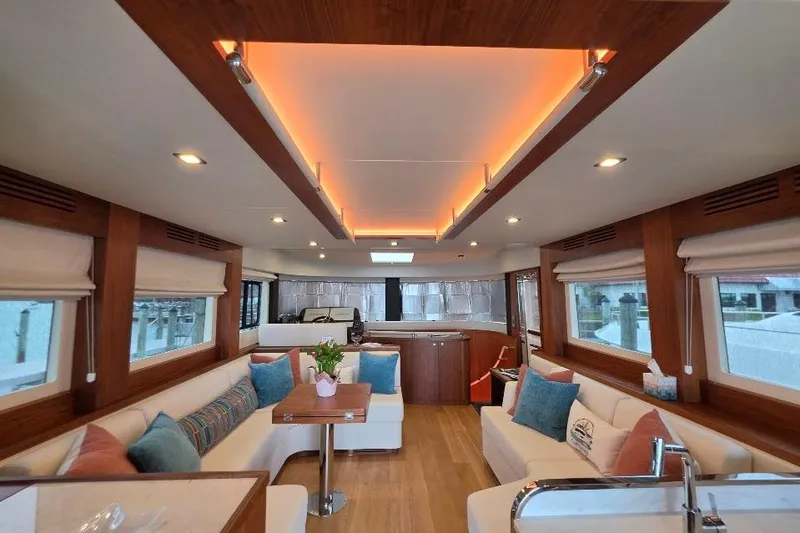 Slide: The Image of Luxurious interior of 2024 Sirena 58 Flybridge MY yacht with elegant seating and ambient lighting. - 72