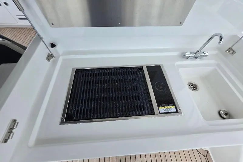Slide: The Image of Outdoor kitchen area on 2024 Sirena 58 Flybridge MY yacht with grill and sink. - 50