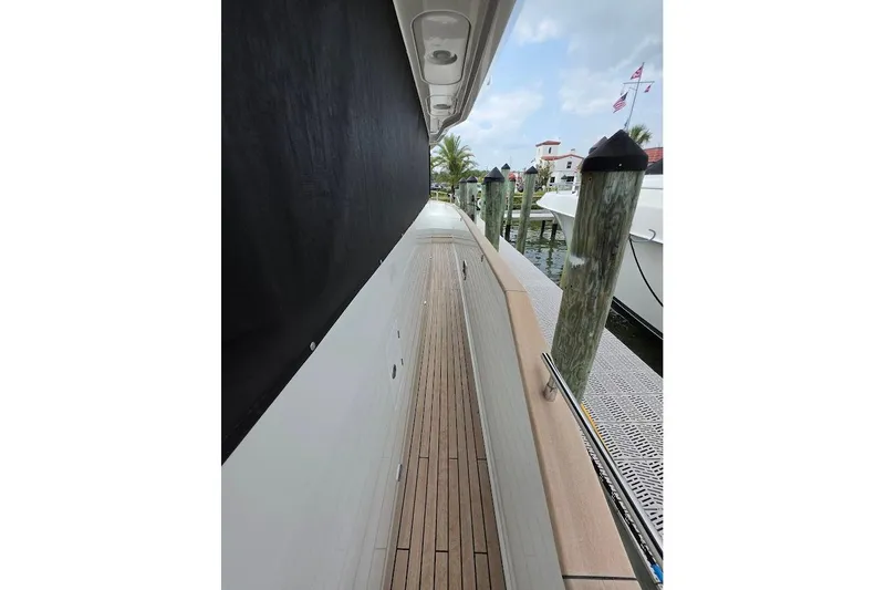 Slide: The Image of Side deck view of 2024 Sirena 58 Flybridge MY yacht at marina. - 18