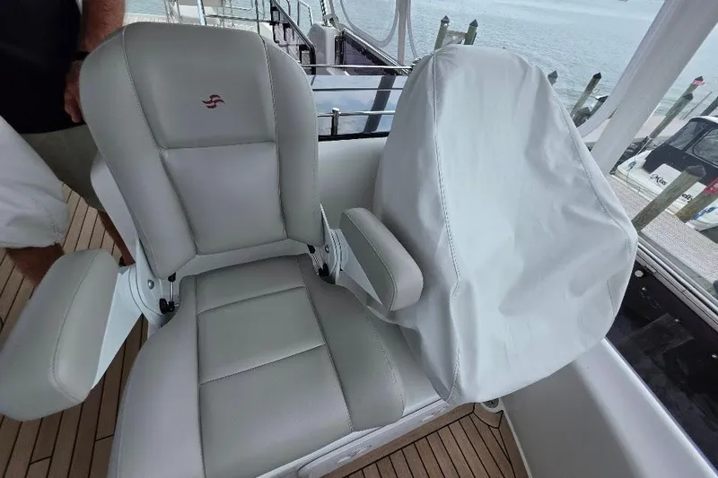 Slide: The Image of Captain's chairs on 2024 Sirena 58 Flybridge MY yacht, featuring sleek design and comfortable seating. - 53