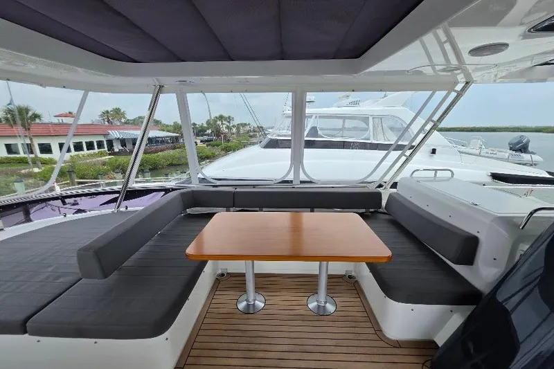 Slide: The Image of Luxurious 2024 Sirena 58 Flybridge MY yacht with spacious seating and elegant wooden table. - 42