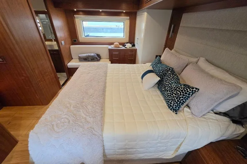 Slide: The Image of Luxurious bedroom interior of 2024 Sirena 58 Flybridge MY yacht with elegant bedding. - 115