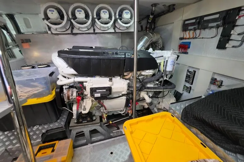 Slide: The Image of Engine room of 2024 Sirena 58 Flybridge MY yacht, showcasing machinery and storage. - 126