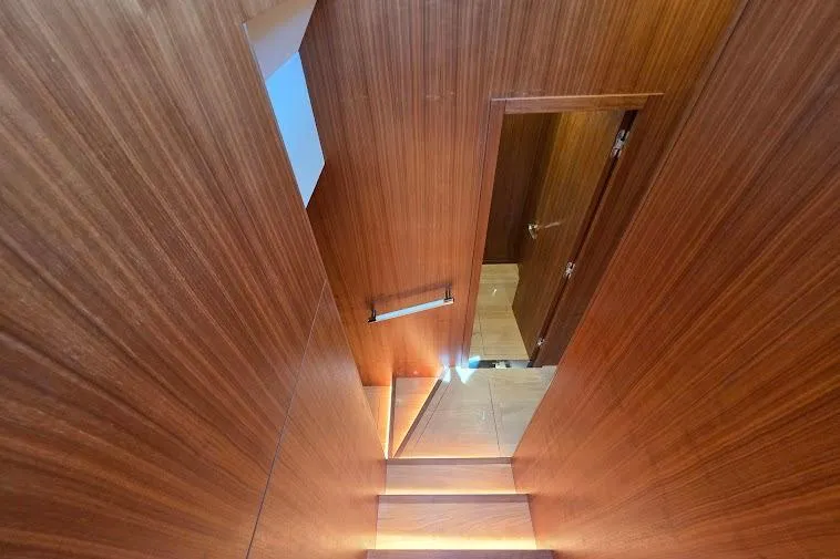 Slide: The Image of Staircase with wooden paneling inside 2024 Sirena 58 Flybridge MY yacht. - 95