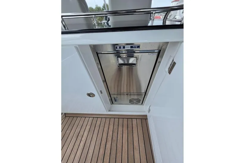 Slide: The Image of Stainless steel appliance on Sirena 58 Flybridge MY 2024 yacht with teak flooring. - 56