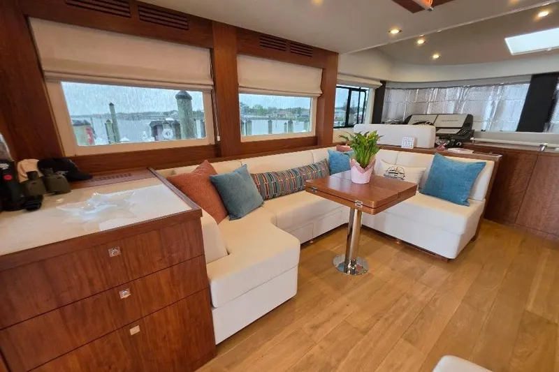 Slide: The Image of Luxurious interior of 2024 Sirena 58 Flybridge MY yacht with elegant seating and decor. - 76