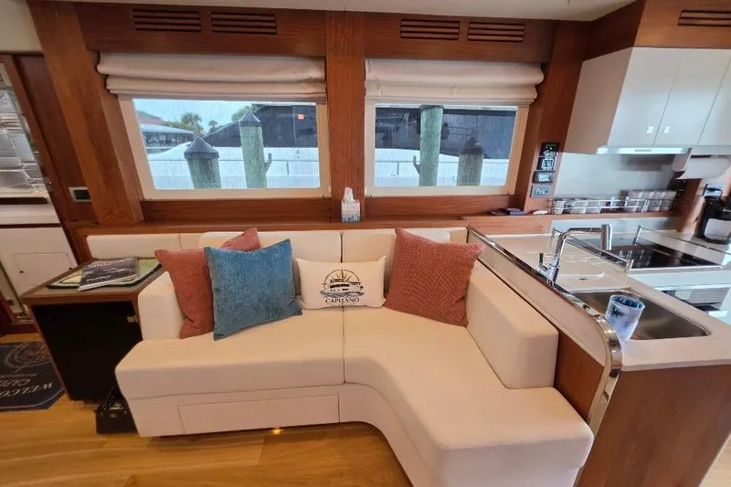 Slide: The Image of Luxurious interior of 2024 Sirena 58 Flybridge MY yacht with cozy seating and modern kitchen. - 74