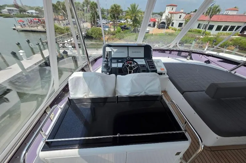 Slide: The Image of Flybridge view of 2024 Sirena 58 FLYBRIDGE MY yacht with helm and seating area. - 31