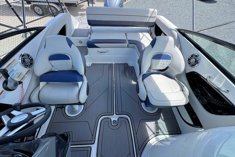 Slide: The Image of 2023 Hurricane SunDeck 2410 OB boat interior with plush seating and modern design. - 21