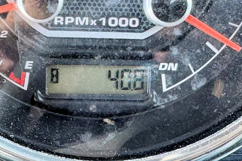 Slide: The Image of Close-up of a 2023 Hurricane SunDeck 2410 OB tachometer displaying 406 RPM. - 15