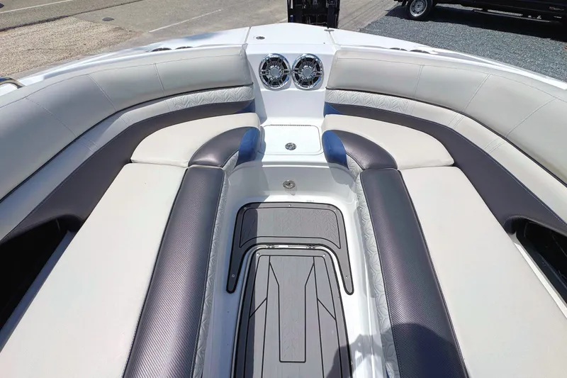 Slide: The Image of 2023 Hurricane SunDeck 2410 OB boat interior with plush seating and modern design. - 18