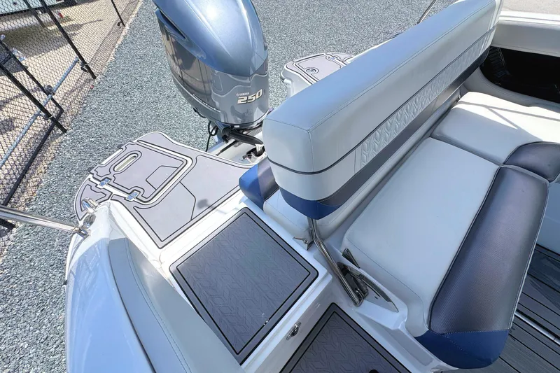 Slide: The Image of 2023 Hurricane SunDeck 2410 OB boat with Yamaha 250 outboard motor and cushioned seating. - 10