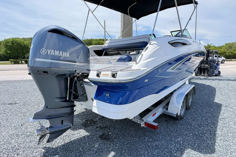 Slide: The Image of 2023 Hurricane SunDeck 2410 OB boat with Yamaha outboard motor on trailer. - 4