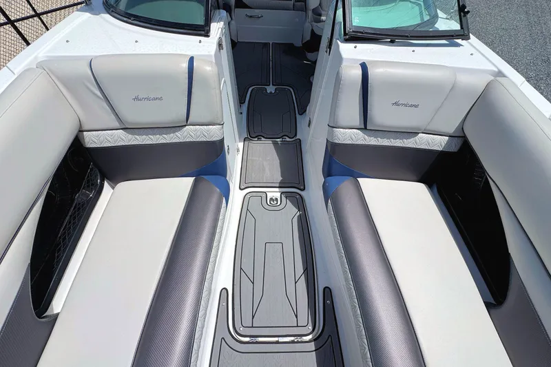 Slide: The Image of 2023 Hurricane SunDeck 2410 OB boat interior with cushioned seating and sleek design. - 19