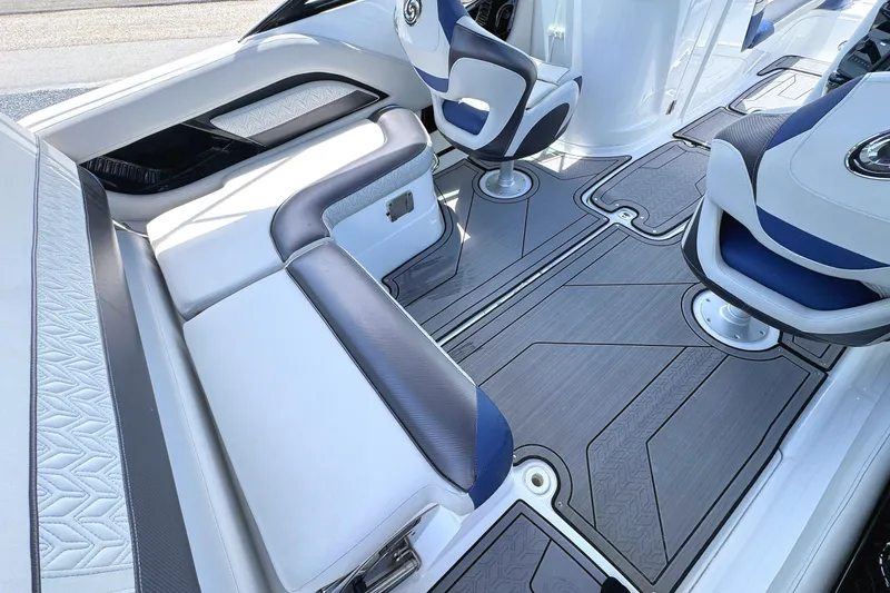 Slide: The Image of 2023 Hurricane SunDeck 2410 OB interior with sleek seating and modern design. - 11