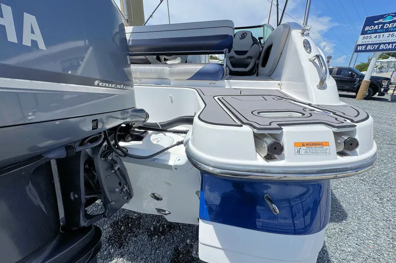 Slide: The Image of 2023 Hurricane SunDeck 2410 OB boat with Yamaha four-stroke engine, rear view. - 9