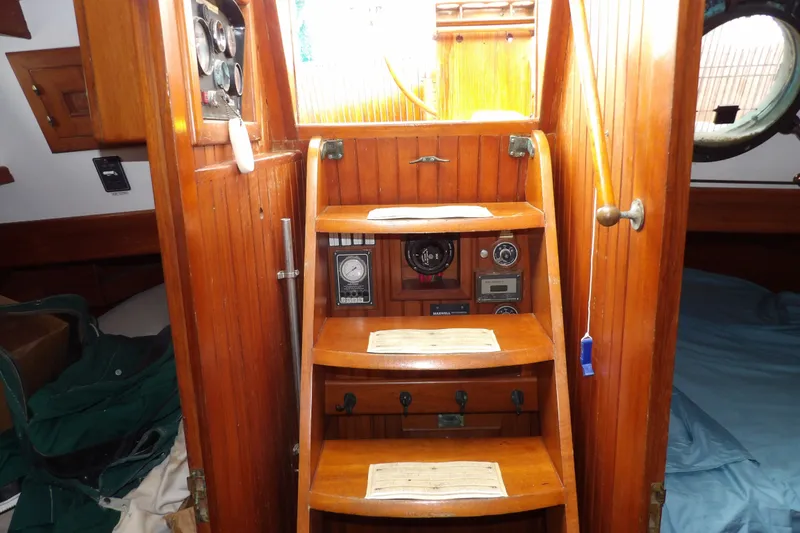 Slide: The Image of Interior of 1986 Hans Christian 43 T sailboat with wooden steps and navigation instruments. - 33