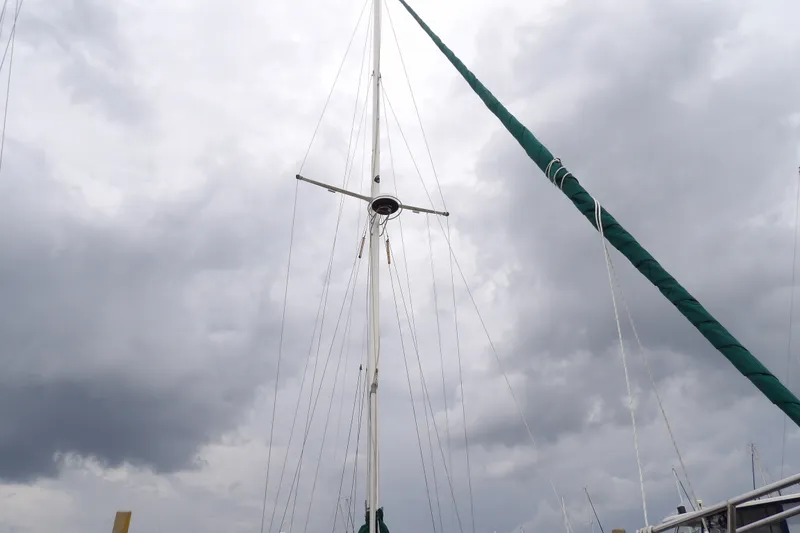 Slide: The Image of Mast of 1986 Hans Christian 43 T sailboat against cloudy sky. - 53