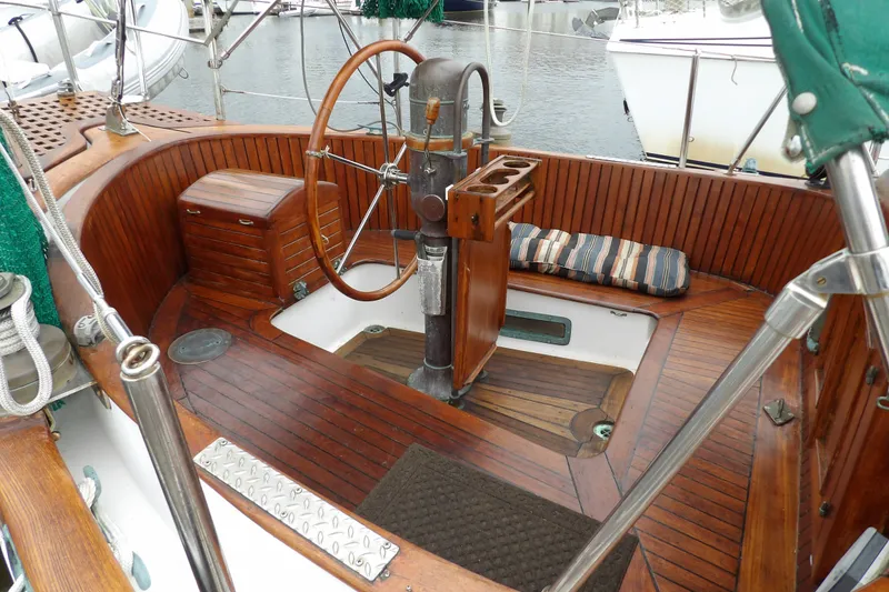 Slide: The Image of 1986 Hans Christian 43 T sailboat cockpit with wooden wheel and seating. - 8