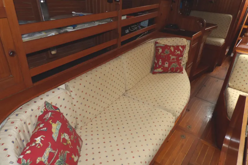 Slide: The Image of Interior of 1986 Hans Christian 43 T sailboat with cozy seating and decorative pillows. - 44