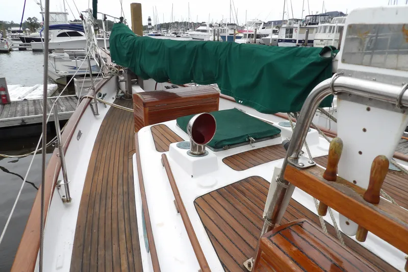 Slide: The Image of 1986 Hans Christian 43 T sailboat deck with wooden finish, docked at marina. - 21