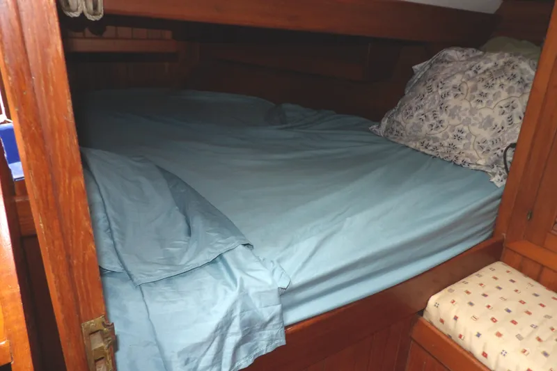 Slide: The Image of Cozy cabin bed with blue sheets in 1986 Hans Christian 43 T sailboat. - 35