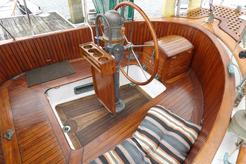Slide: The Image of Cockpit of 1986 Hans Christian 43 T sailboat with wooden steering wheel and seating. - 10