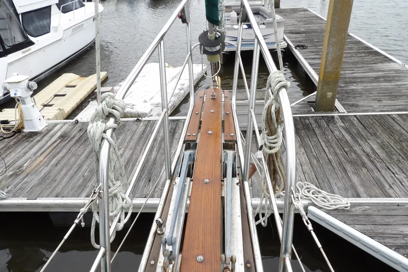 Slide: The Image of 1986 Hans Christian 43 T sailboat docked, showing deck and rigging details. - 25