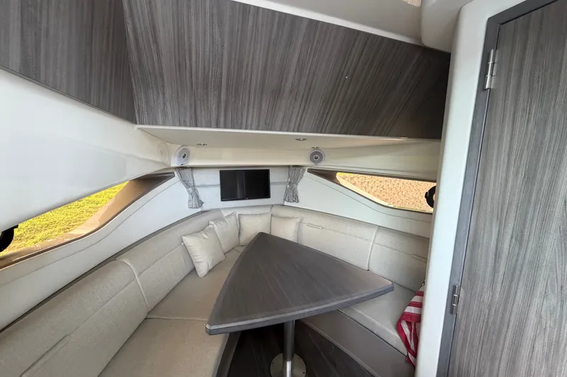 Slide: The Image of Interior of 2021 Sea Ray Sundancer 320, featuring a cozy seating area and modern design. - 39
