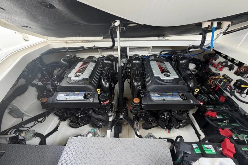Slide: The Image of Engine compartment of a 2021 Sea Ray Sundancer 320 with dual engines and battery setup. - 28