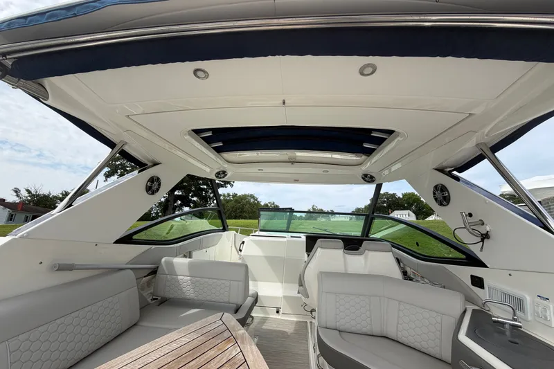 Slide: The Image of Interior view of 2021 Sea Ray Sundancer 320 boat with luxurious seating and modern design. - 12