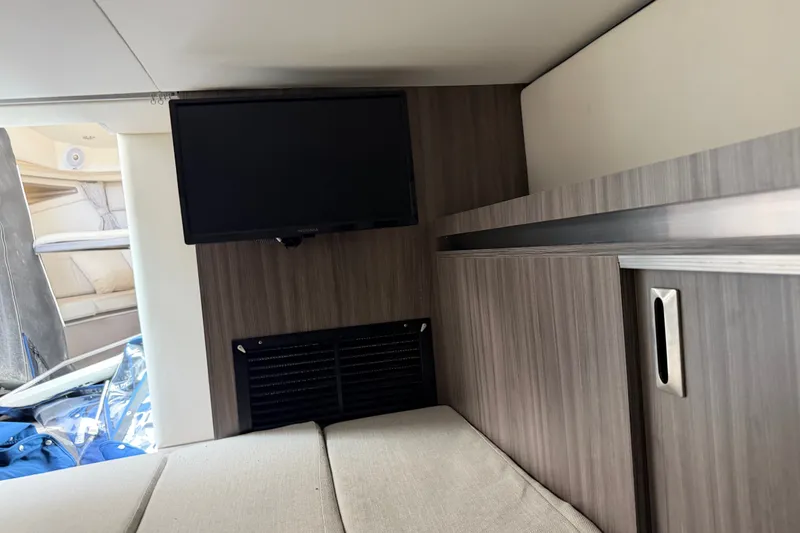 Slide: The Image of Interior of 2021 Sea Ray Sundancer 320 with TV and modern cabinetry. - 32