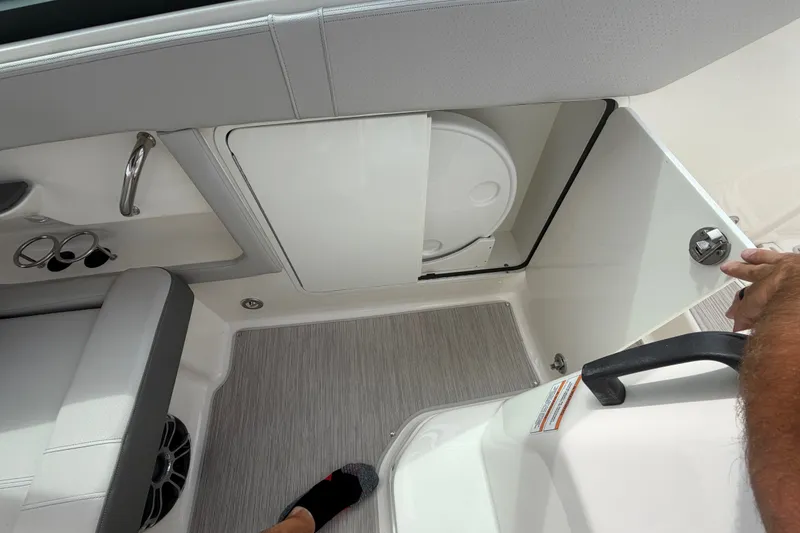 Slide: The Image of 2021 Sea Ray Sundancer 320 interior with seating and storage compartment. - 24